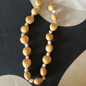 Light brown and white beaded necklace